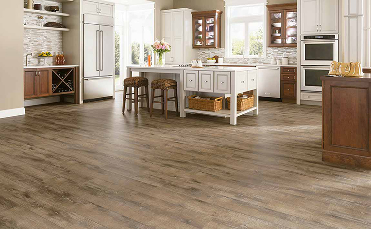 Light Brown Hardwood Floor in Large Light Colored Kitchen